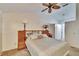 Main bedroom with king bed, ceiling fan and access to bathroom at 9402 Forest Hills Cir, Tampa, FL 33612