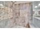 Large walk-in shower with built-in seat and neutral tile at 9402 Forest Hills Cir, Tampa, FL 33612