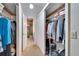 Large walk-in closet with double doors and ample shelving at 9402 Forest Hills Cir, Tampa, FL 33612