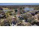 Bird's-eye view of home near a lake and golf course community at 12818 Royal George Ave, Odessa, FL 33556