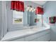 Bathroom with a vanity and window with view at 12818 Royal George Ave, Odessa, FL 33556