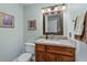 Updated bathroom with granite countertop and wood cabinets at 12818 Royal George Ave, Odessa, FL 33556