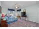 Bedroom with a full-size bed and window views at 12818 Royal George Ave, Odessa, FL 33556