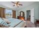 Bright bedroom with plush bedding and ample closet space at 12818 Royal George Ave, Odessa, FL 33556