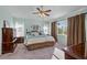 Spacious bedroom with carpeted floors and a ceiling fan at 12818 Royal George Ave, Odessa, FL 33556