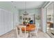 Bright breakfast nook with a round table and chairs, adjacent to the kitchen at 12818 Royal George Ave, Odessa, FL 33556