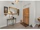 Bright and welcoming entryway with wood floors and decorative accents at 12818 Royal George Ave, Odessa, FL 33556