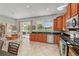 Spacious kitchen with island, stainless steel appliances, and backyard view at 12818 Royal George Ave, Odessa, FL 33556