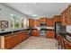 Well-equipped kitchen with ample cabinetry, granite countertops, and stainless steel appliances at 12818 Royal George Ave, Odessa, FL 33556