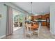 Kitchen with breakfast nook, view of living room and access to patio at 12818 Royal George Ave, Odessa, FL 33556