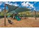 Community playground with shade structure, slides, and play equipment at 12818 Royal George Ave, Odessa, FL 33556
