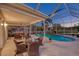 Enclosed patio with pool and view of golf course at 12818 Royal George Ave, Odessa, FL 33556