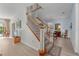 Elegant staircase leading to the upper level at 12818 Royal George Ave, Odessa, FL 33556