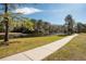 Pathway alongside lake in community at 12818 Royal George Ave, Odessa, FL 33556