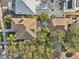 Aerial view of a home showcasing a brown tile roof, lush landscaping, and backyard pool at 2001 Beach Se Dr, St Petersburg, FL 33705