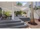 A beautiful outdoor living space with a pergola, hot tub, and elegant landscaping at 2001 Beach Se Dr, St Petersburg, FL 33705