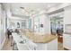 Open concept kitchen with a large island, bar seating, and stainless steel appliances at 2001 Beach Se Dr, St Petersburg, FL 33705