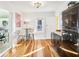 Updated kitchen with black retro-style fridge, eat in area and hardwood floors at 2001 Beach Se Dr, St Petersburg, FL 33705