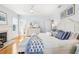 Spacious main bedroom featuring hardwood floors, a fireplace, and a spa-like ensuite bathroom at 2001 Beach Se Dr, St Petersburg, FL 33705