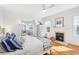 Serene main bedroom boasts a fireplace, hardwood floors, and an adjoining seating area at 2001 Beach Se Dr, St Petersburg, FL 33705