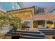 Cozy covered patio with outdoor seating, a hot tub, and ambient string lights for relaxing evenings at 2001 Beach Se Dr, St Petersburg, FL 33705