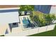 Backyard pool featuring clear blue water, in-pool loungers, and surrounding tropical landscaping at 2001 Beach Se Dr, St Petersburg, FL 33705