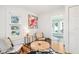 Cozy sitting area features two cushioned chairs, a round table, and a cowhide rug at 2001 Beach Se Dr, St Petersburg, FL 33705