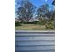 View of backyard from behind a fence at 5357 Cobblestone Ct, Wesley Chapel, FL 33543