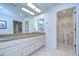 Bathroom with double vanity, granite countertop and toilet at 5357 Cobblestone Ct, Wesley Chapel, FL 33543