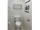 Simple bathroom with toilet and wall-mounted towel rack at 5357 Cobblestone Ct, Wesley Chapel, FL 33543