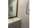 Bathroom with gray vanity and large framed mirror at 5357 Cobblestone Ct, Wesley Chapel, FL 33543