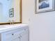 Small bathroom with gray vanity and framed mirror at 5357 Cobblestone Ct, Wesley Chapel, FL 33543