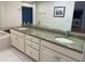 Double vanity bathroom with granite countertops at 5357 Cobblestone Ct, Wesley Chapel, FL 33543