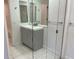 Bathroom with gray vanity and glass-enclosed shower at 5357 Cobblestone Ct, Wesley Chapel, FL 33543