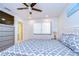 Spacious bedroom with large TV, dresser and a king-size bed at 5357 Cobblestone Ct, Wesley Chapel, FL 33543