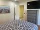 Bedroom with dresser, mounted TV and hardwood floors at 5357 Cobblestone Ct, Wesley Chapel, FL 33543
