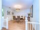 Elegant dining room with white table, gray chairs, and a chandelier at 5357 Cobblestone Ct, Wesley Chapel, FL 33543