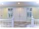 Elegant entryway with double doors and white railings at 5357 Cobblestone Ct, Wesley Chapel, FL 33543