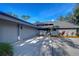 Gray house with a dark gray roof and landscaping at 5357 Cobblestone Ct, Wesley Chapel, FL 33543