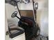 White golf cart parked in garage at 5357 Cobblestone Ct, Wesley Chapel, FL 33543