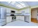 Kitchen with granite countertops, stainless steel appliances, and tiled floors at 5357 Cobblestone Ct, Wesley Chapel, FL 33543