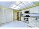 Kitchen with granite countertops, stainless steel appliances, and tiled floors at 5357 Cobblestone Ct, Wesley Chapel, FL 33543