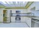 Stainless steel appliances and granite countertops in a well-lit kitchen at 5357 Cobblestone Ct, Wesley Chapel, FL 33543
