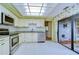 Bright kitchen features granite countertops, stainless steel appliances, and white cabinets at 5357 Cobblestone Ct, Wesley Chapel, FL 33543