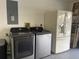 Bright laundry room with washer, dryer and refrigerator at 5357 Cobblestone Ct, Wesley Chapel, FL 33543