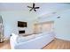 Spacious living room features a vaulted ceiling, fireplace, and large sectional sofa at 5357 Cobblestone Ct, Wesley Chapel, FL 33543