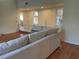 Living area showcasing hardwood floors and double doors at 5357 Cobblestone Ct, Wesley Chapel, FL 33543