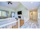 Spacious living room with vaulted ceiling, fireplace and hardwood flooring at 5357 Cobblestone Ct, Wesley Chapel, FL 33543