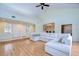 Living room with hardwood floors and sectional sofa at 5357 Cobblestone Ct, Wesley Chapel, FL 33543