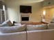 Living room with hardwood floors, fireplace, and sectional sofa at 5357 Cobblestone Ct, Wesley Chapel, FL 33543